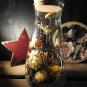 Globe en verre et bouchon de liège, composé de fleurs séchées dans les tons safrans.